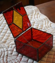 red jewelry box with decorative soldering